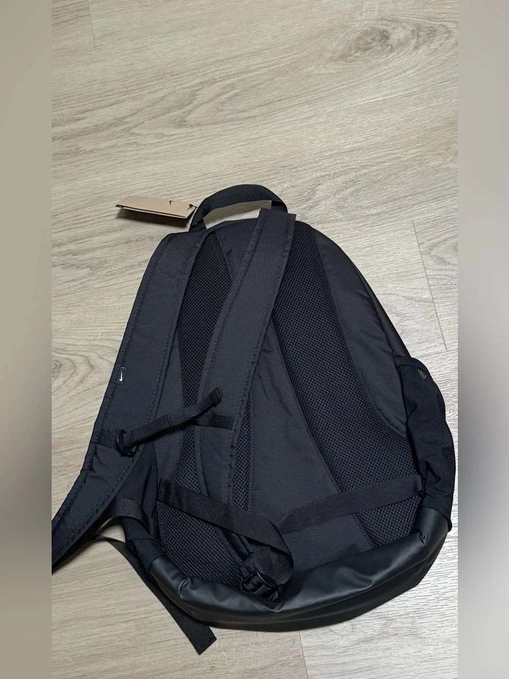 Nike Black Backpack with White Swoosh and Orange Accents